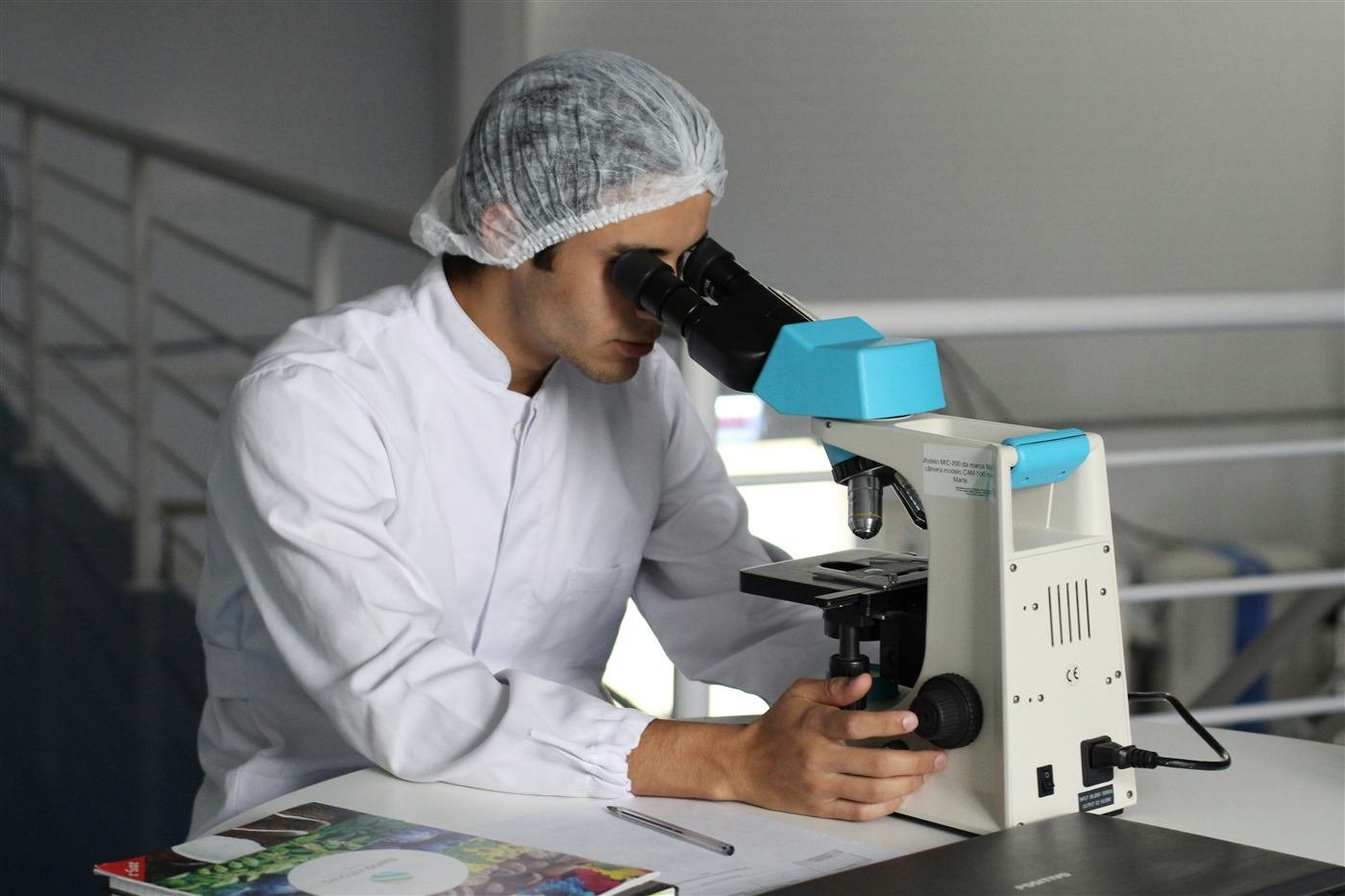 Row of research microscopes in a university science laboratory
